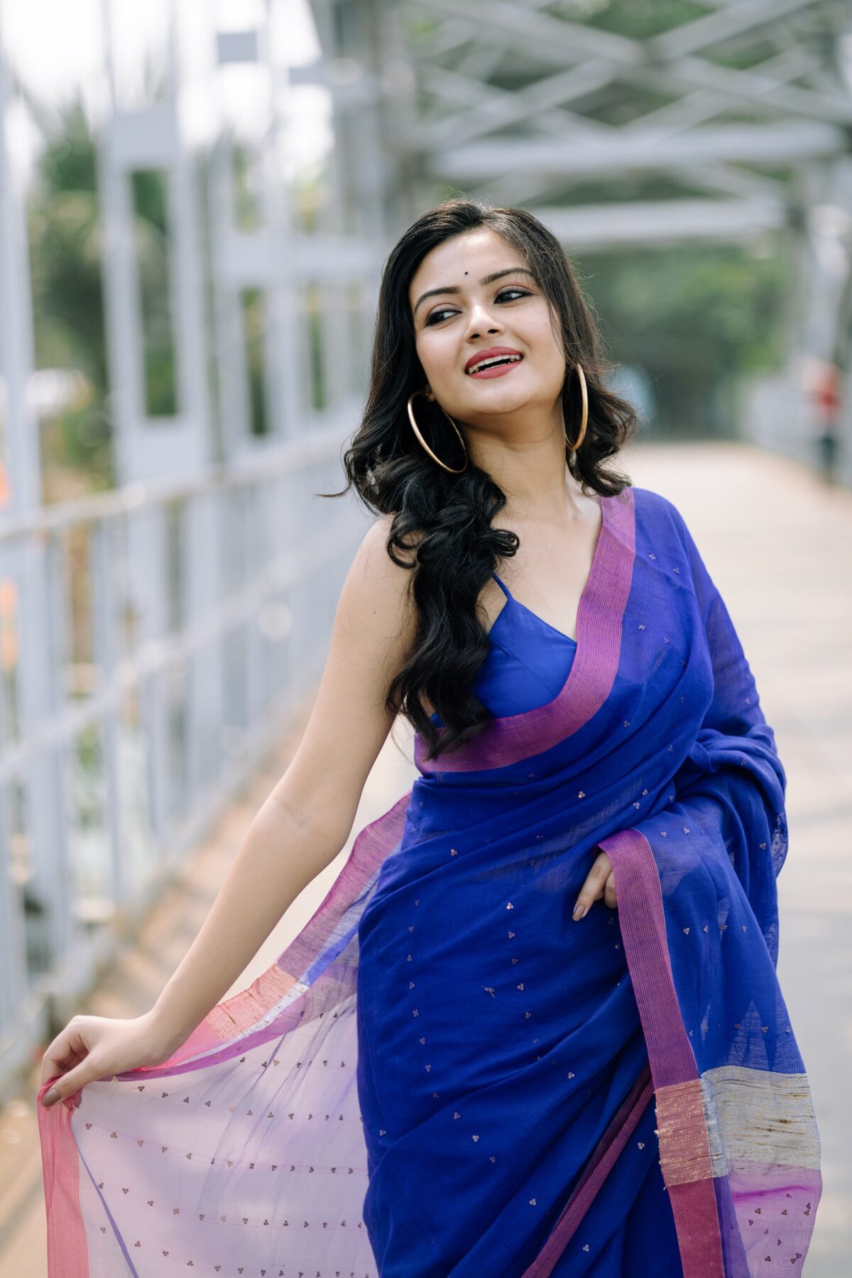 The aqua blue pure matka with a contrast baby pink & beige ghicha pallu with whole body sequence work - Image 2